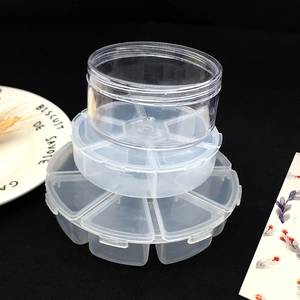 Close-up of clear plastic storage boxes showing single and multi-compartment organizers