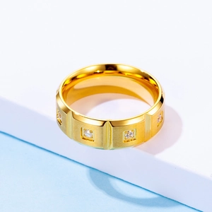 Matte brushed 18K gold ring with clear zircons on minimalist geometric background