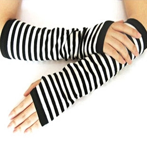 Detail of black and white striped long knit arm sleeves with fingerless thumb hole