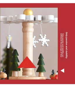 Detailed close-up of a wooden Christmas music box with reindeer and tree ornaments