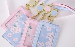 Detail of PU leather ID card holders with cherry blossom print and telescopic lanyards