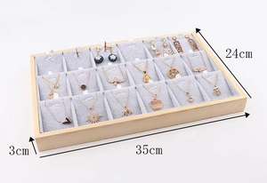 Detail view of 18-compartment wooden jewelry tray with dimensions 35x24x3cm and velvet liner