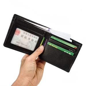 Detail view of the black bifold leather wallet interior with card slots and ID window