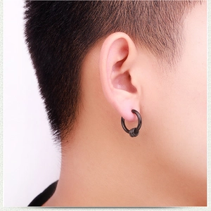 Close-up of men's matte black hoop earring with textured triple wire wrap detail