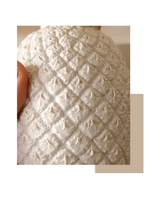 Close-up of lifelike white pineapple ornament showing realistic texture and detailed barbs
