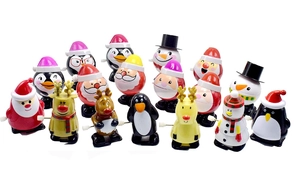 Close-up of assorted Christmas wind-up toys including Santa, Snowman, and Reindeer models