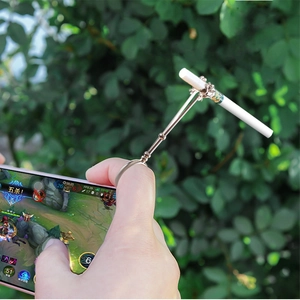 Macro shot of rose gold metal smoking ring holder for hands-free gaming or office use