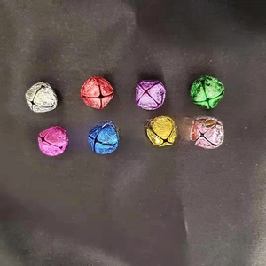 Close-up of colorful cross-cut bells in 8 metallic colors for DIY crafts and decor