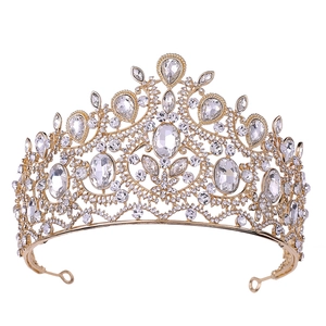 Detailed view of luxury baroque golden crown with sparkling rhinestones and pear gems