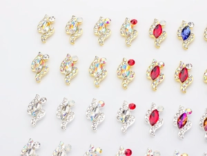 Macro shot of K9 alloy marquise-cut nail art gems with sparkling zircon embellishments