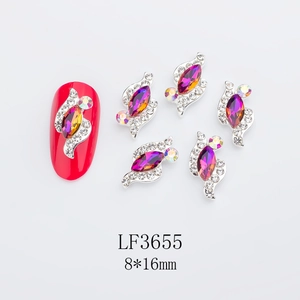 Macro shot of 8x16mm silver horse-eye alloy nail charms with purple rhinestones