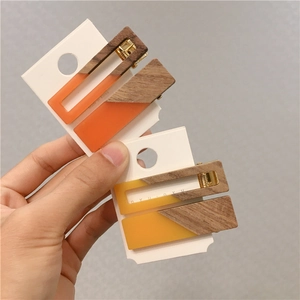 Set of triangular wooden and resin hair clips in orange and yellow candy colors