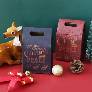 Blue and red Christmas gift boxes with reindeer prints and festive holiday decorations