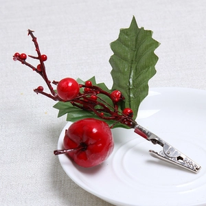 Artificial Christmas berry pick with red apple and green leaves on silver metal clip