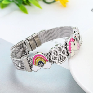 Detail of adjustable stainless steel mesh bracelet with rainbow and unicorn charms