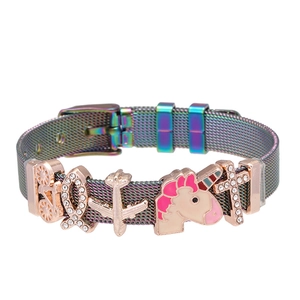 Rainbow mesh bracelet with rose gold charms including unicorn and bicycle detail view