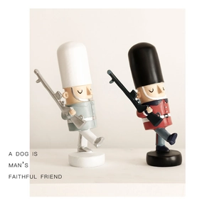 Detail of creative British soldier nutcracker resin figurines on a clean white surface