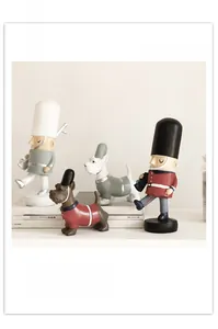 Detail shot of Nutcracker soldier and dog figurines set in minimalist matte finish