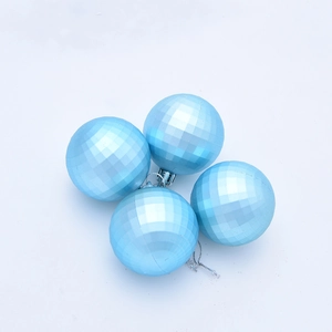 Detail showing four 5cm blue faceted Christmas balls with shiny diamond-cut textures
