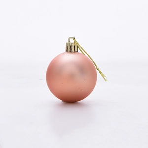 Detail of 5cm matte rose gold Christmas ball ornament with golden hanging string and cap