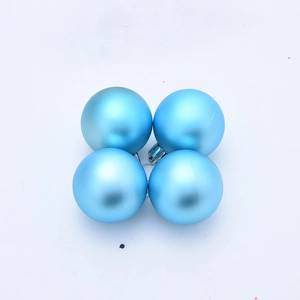 Detail view of four matte blue 5cm Christmas balls set in a minimalist grid arrangement