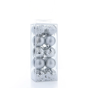 Detail of silver plated Christmas balls with various textures in a Merry Christmas display box