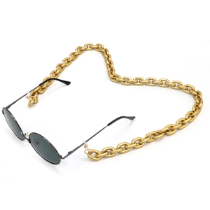 Chunky gold alloy eyewear chain with black sunglasses on white background