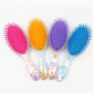 Set of four colorful glitter hairbrushes with cute cartoon patterns and transparent handles