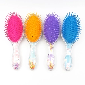 Set of four colorful glitter hairbrushes with cute cartoon patterns and sequins
