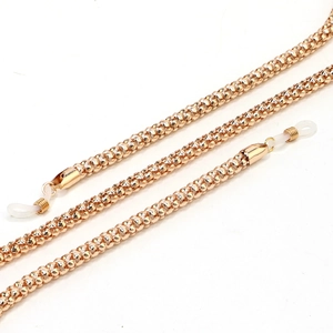 Close-up of 6.0mm golden metal corn chain for glasses with white silicone non-slip ends