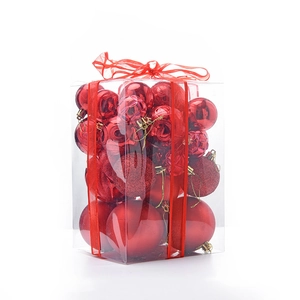 Set of 30 red Christmas balls in a transparent gift box with diverse textures and a red bow