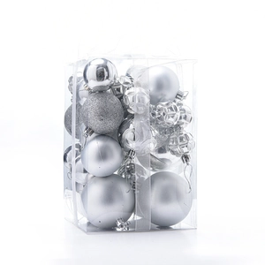 Detail of silver Christmas ball assortment showing glitter and matte textures in box