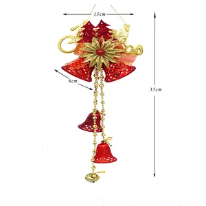 Christmas tree decoration with red bells, gold flower and Merry Christmas signage