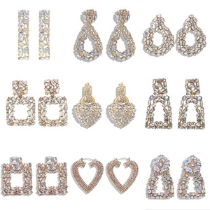 Detail view of assorted geometric crystal drop earrings with sparkling rhinestones