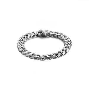 Sleek unisex silver Cuban link bracelet in polished stainless steel on a white background