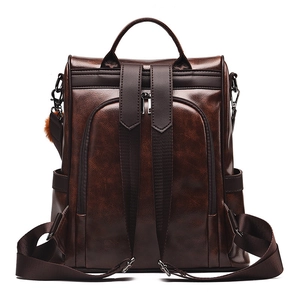 Women's dark coffee PU leather backpack with adjustable straps and plush ball charm