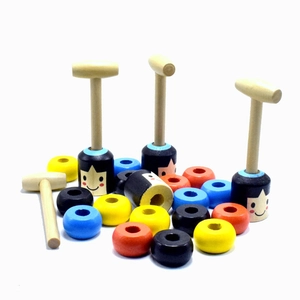 Close-up of wooden hammers and colorful rings set for magic knockdown puppet toy