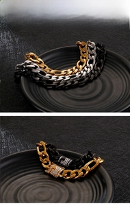 Close-up of 18K gold and silver NK link bracelets with crystal pavé rhinestone clasps