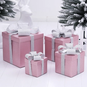 Pink glitter Christmas gift box set with silver ribbons for festive window decoration