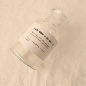 Minimalist decorative clear glass vase with ins style English label on linen fabric