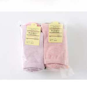 Detailed retail packaging of candy colored cotton socks with Japanese tags in clear bags
