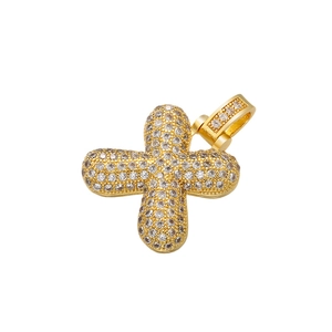 Close-up of hip-hop cross pendant with full diamond inlay on a white background