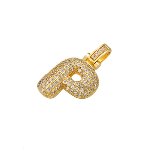 Macro shot of hip hop bubble letter P pendant with sparkling clear crystals in gold