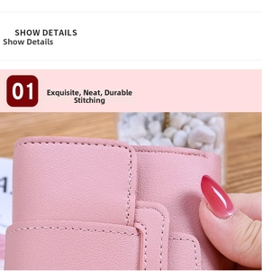 Close-up of fine stitching and litchi grain texture on pink faux leather wallet