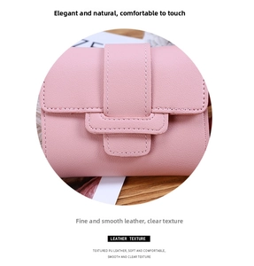 Macro detail of soft pink PU leather wallet showing textured finish and neat stitching