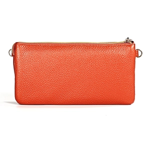 Detail of orange litchi grain leather texture on long wallet with gold metal zipper