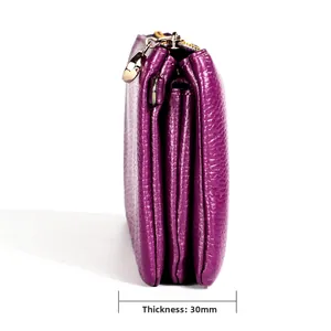 Side view of purple leather bag with three zip compartments and 30mm thickness detail