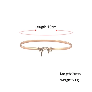 Detailed view of elastic gold bow belt showing 70cm length and 71g weight parameters