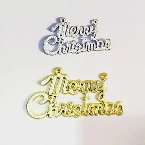 Detail of gold and silver Merry Christmas lettering ornaments for tree decoration