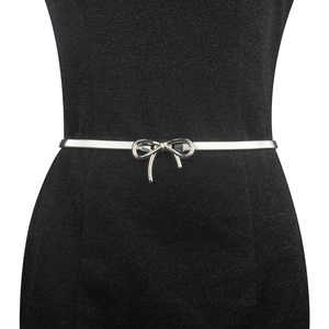 Close-up of a silver bow buckle elastic waist chain on a black glitter dress for women
